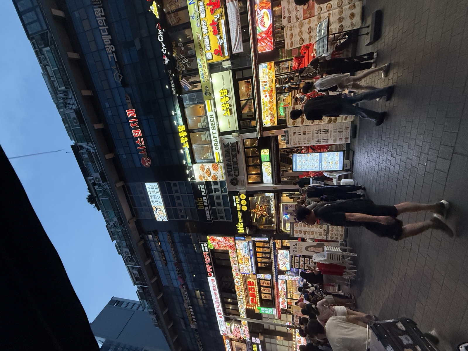 Myeongdong shopping street in Seoul lit up at night